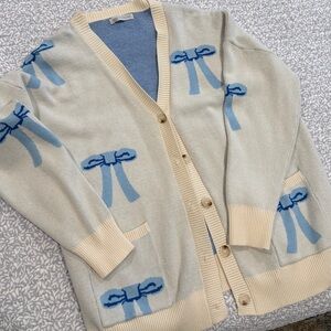 Beige Cardigan with Blue Bow Accents